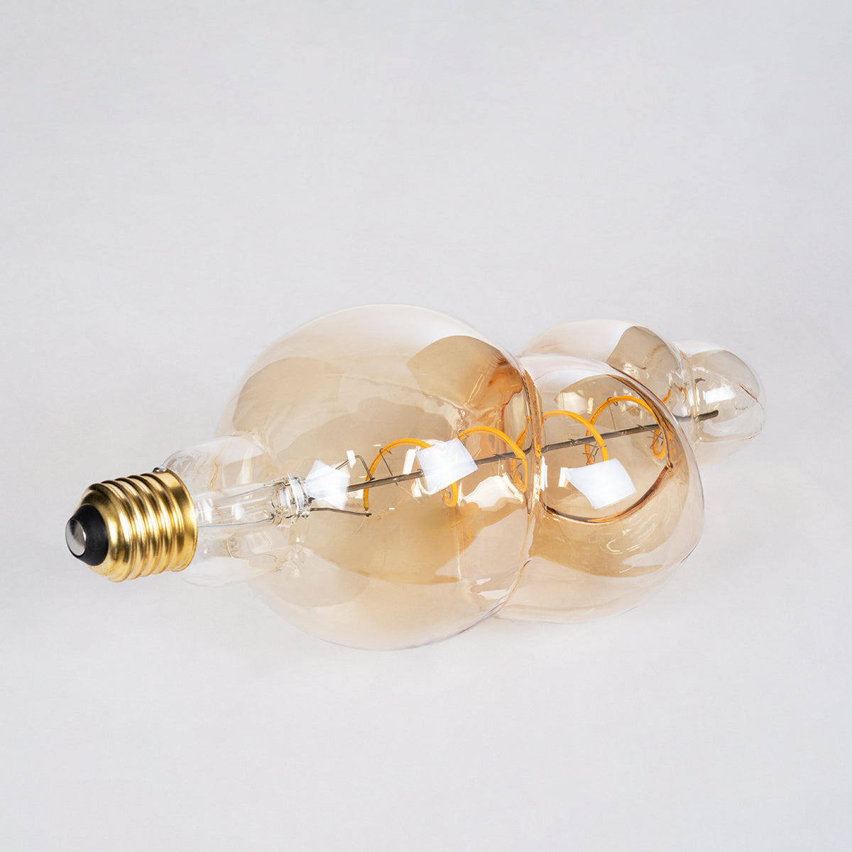 GloboStar® 99021 Λάμπα LED Soft S Spiral Filament E27 BB100 BUBBLES Γλόμπος 6W 420lm 360° AC 220-240V IP20 Φ10 x Υ24cm Ultra Θερμό Λευκό 2200K με Μελί Γυαλί - Dimmable - 3 Years Warranty - ledmania.gr