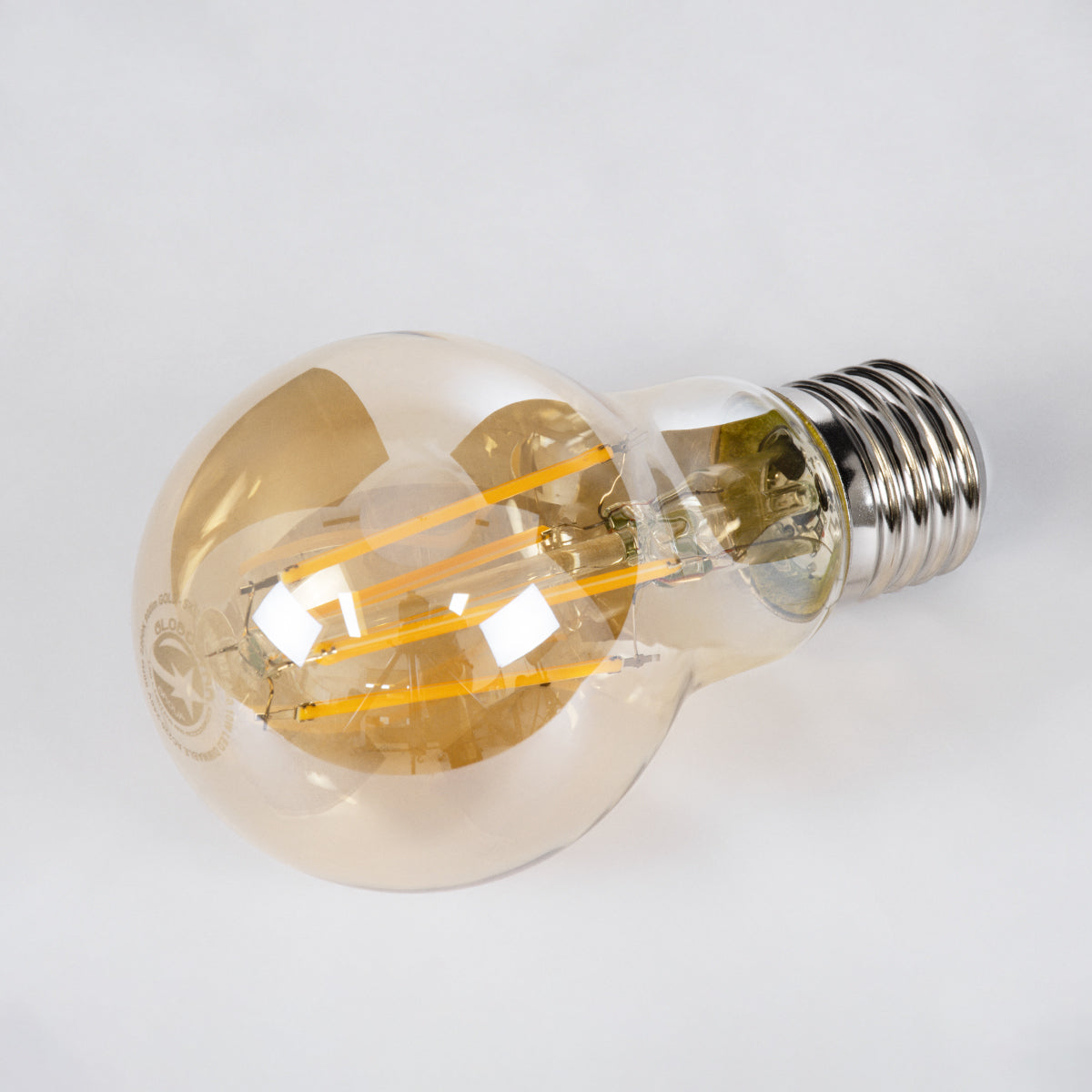 GloboStar® 99038 LED Long Filament Bulb E27 A60 Globe 10W 900lm 360° AC 220-240V IP20 D6 x H10.5cm Ultra Θερμό Λευκό 2200K με Μελί Γυαλί - Dimmable - 3 Years Warranty - ledmania.gr