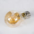 GloboStar® 99038 LED Long Filament Bulb E27 A60 Globe 10W 900lm 360° AC 220-240V IP20 D6 x H10.5cm Ultra Θερμό Λευκό 2200K με Μελί Γυαλί - Dimmable - 3 Years Warranty - ledmania.gr