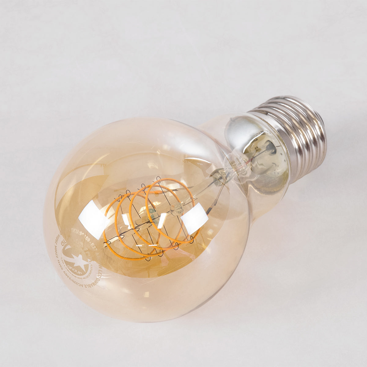 GloboStar® 99059 Λάμπα LED Ultra Thin Soft S Spiral Filament E27 A60 Γλόμπος 4W 280lm 360° AC 220-240V IP20 Φ6 x Υ10.5cm Ultra Θερμό Λευκό 2200K με Μελί Γυαλί - Dimmable - 3 Years Warranty - ledmania.gr
