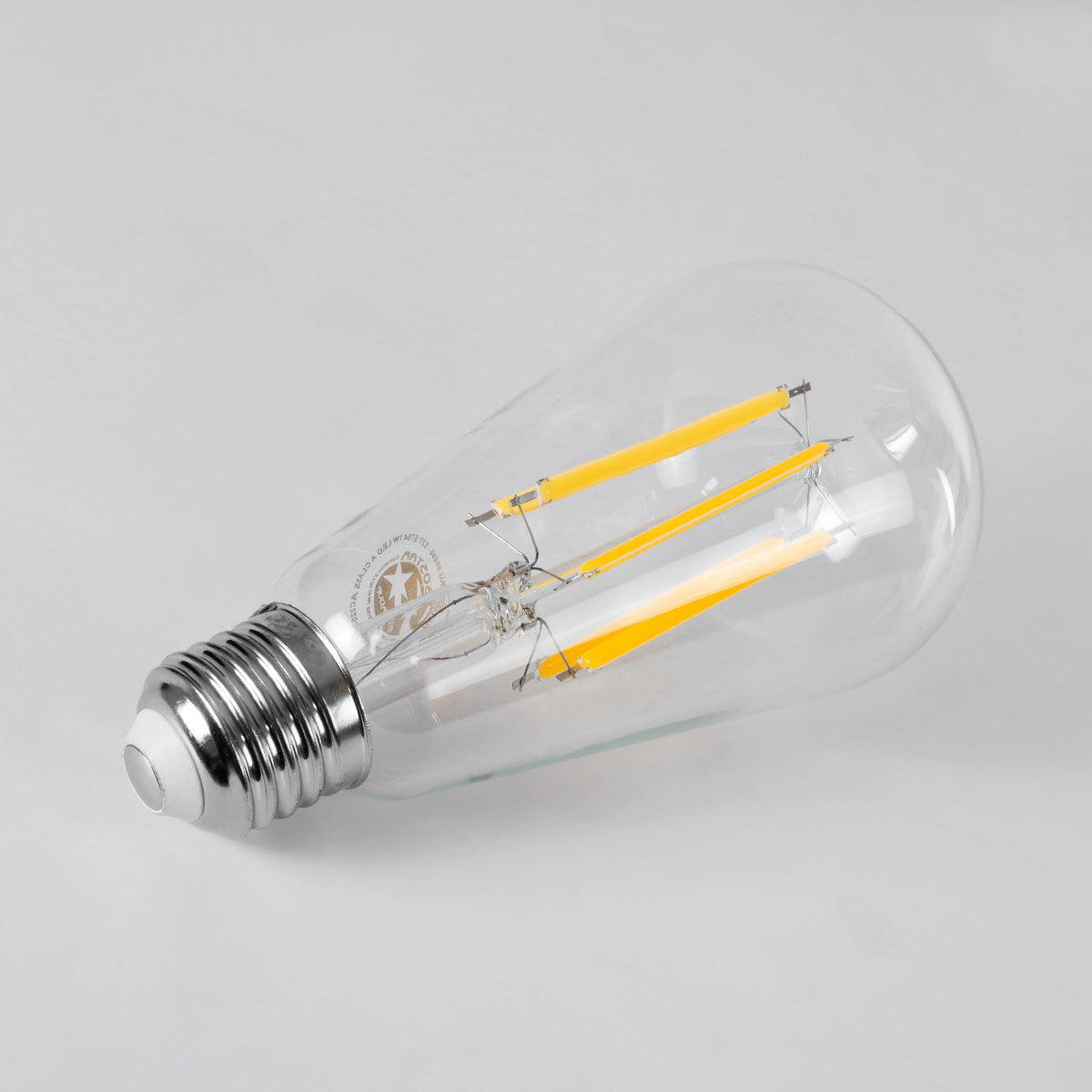 GloboStar® 99090 Λάμπα LED Long Filament E27 ST64 Αχλάδι 7W 1470lm 360° AC 220-240V IP20 Φ6.4 x Υ14.5cm Θερμό Λευκό 2700K με Διάφανο Γυαλί - Pro Series 210lm/W - A Ενεργειακή Κλάση - 3 Χρόνια Εγγύηση - ledmania.gr